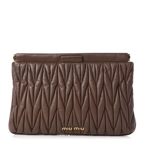 Miu Miu matelasse clutch reveal 